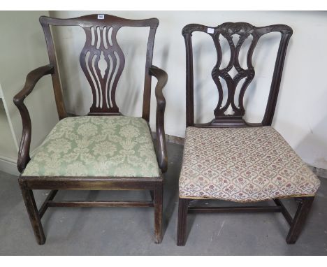 Two Georgian mahogany Chippendale style dining chairs (one carver) with fret work to urn shaped splats, fabric upholstered se