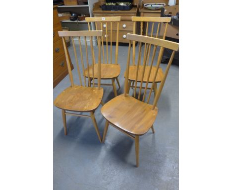 A set of four Ercol elm seated stick back kitchen chairs stamped 1960 2056