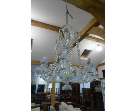 An eight branch crystal glass ceiling chandelier with beaded swags, droplets to saucers on waisted base - Height 80cm