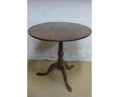 A Georgian oak tripod occasional table with flip top action - 64cm x 76cm diameter