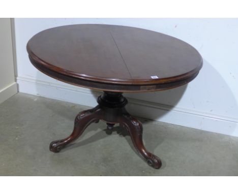 A Victorian mahogany circular breakfast table on baluster column and carved tripod base with castors - 73cm x Diameter 105cm 