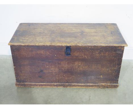 A late 19th century pine rectangular trunk with lift up lid and metal side handles - 45cm x 91cm x 41cm
