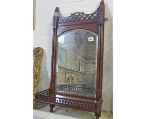 An Edwardian mahogany framed wall mirror with a shelf and column supports - Height 80cm x Width 38cm x Depth 19cm