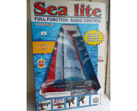 FULL FUNCTION RADIO CONTROLLED 'SEA LITE' SAILING BOAT, CONTROLS SAIL RUDDER AND OUTBOARD MOTOR 1:25 SCALE LENGTH 550 MMS HEI