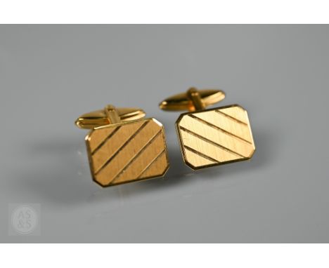 A pair of 9ct yellow gold cufflinks of chamfered rectangular form with swivel backs, approx 5.5g