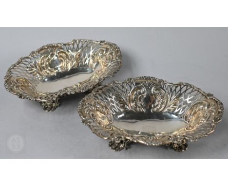 A pair of Victorian silver oval bonbon dishes with embossed and pierced decoration,&nbsp;William Hutton &amp; Sons, London 18