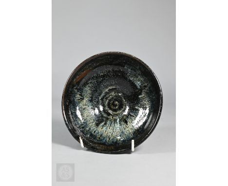 A Chinese Song style jian yao 'hare's fur' bowl covered in an opaque blue black unctuous striated glaze stopping short of the