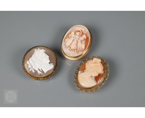 Three shell cameo brooches, one depicting the Three Graces, in oval yellow metal mount stamped 375, 3.5 x 3 cm; one featuring
