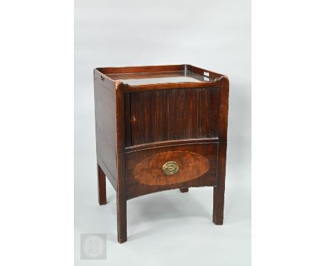 A Georgian mahogany concave form tray-top step commode, with tambour door over a fitted drawer, raised on square square feet,