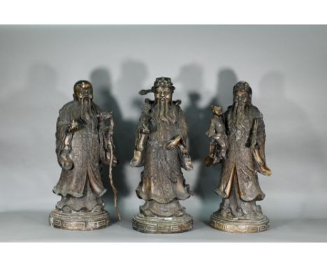 Three large Chinese bronze 'Star Gods' (Sanxing)&nbsp;Fu, the personification of good fortune, depicted in scholar's dress ho