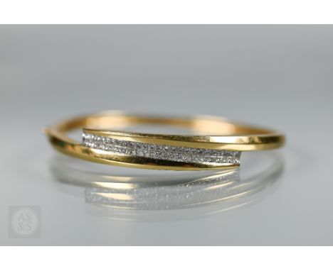 An oval half-hinged bangle, set with fifty square channel set diamonds, unmarked yellow metal, approx 23g all in