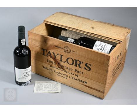 Eleven bottles 1985 vintage Taylors Port, in original wooden case&nbsp; No warranty offered as to condition/drinkability