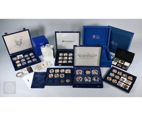 Various cupro-nickel, gilt and enamel commemorative coins to/w two silver-plated Royal Mint money boxes (boxed as new) and a 