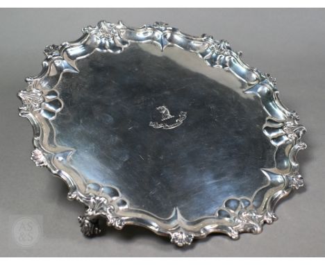 A large silver salver in the Georgian taste, with moulded rim and three scroll feet, William Hutton &amp; Sons Ltd., London 1