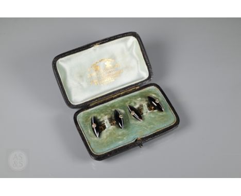 A pair of Art Deco banded onyx torpedo shaped cufflinks with diamond set decoration, yellow metal chain links, cased