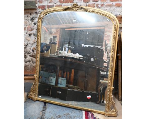 A Victorian giltwood and composite arched top over-mantel, with original mirror plate, 130 cm w x 136 w o/all