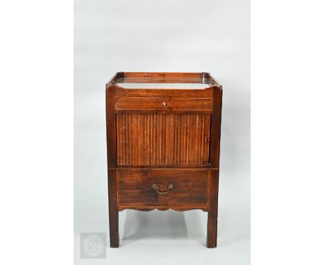 A Georgian mahogany concave form tray top commode, with a frieze drawer over a tambour door and fitted step, on square legs, 