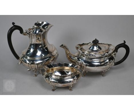 A heavy quality silver teapot, hot water jug and sugar basin, with composite mounts, William Aitken, Birmingham 1918, 49oz gr