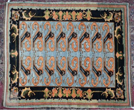 A vintage powder blue ground rug with palmette border, 198 cm x 170 cm