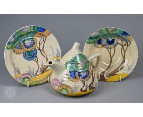 A Clarice Cliff 'Lynton' shape teapot, painted in 'Rodanthe' to/w a matching saucer and plate (3)