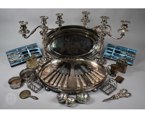 A pair of 19th Century plated on copper twin-branch candelabra 36cm high, to/w a graduated pair of Alpha Plate oval platters,