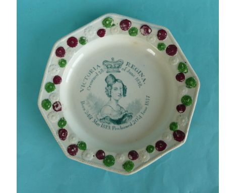 1838 Coronation: an octagonal pottery plate with colourful florette moulded border printed in green with an inscribed portrai
