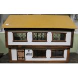 A modern four room dolls house "Debs Cottage" in the Tudor style