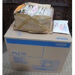 A Brother FS210 sewing machine with an assortment of dress making patterns