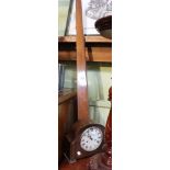 An oak cased mantle clock with a draftsman set square