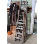 A collection of vintage wood and metal framed step ladders and extending ladders (4)