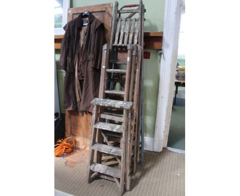 A collection of vintage wood and metal framed step ladders and extending ladders (4)