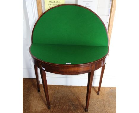 An Edwardian mahogany lift top card table