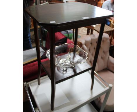 A tall mahogany side table with under tier shelf