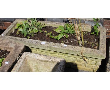 A cast garden trough style planter