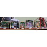 Lemax, six Christmas boxed decorative models and a mini Christmas tree