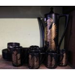 A Portmeirion pottery phoenix coffee set by John Cuffley, six cans and saucers,