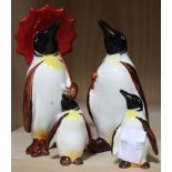 Beswick - a family of four penguins