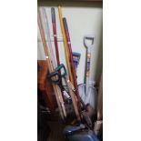 A selection of garden tools to include snow shovel, forks and spades etc