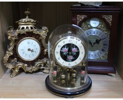 A Georgian design bracket clock with two other decorative mantle clocks