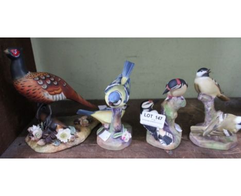 A Royal Crown Derby bone china Pheasant, together with three Royal Worcester bone china garden birds (4)