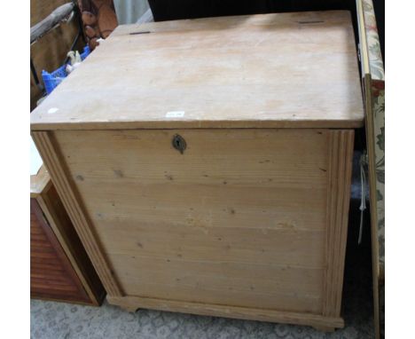 An old pine trunk with lift up lid containing two internal sections one having a lift up lid