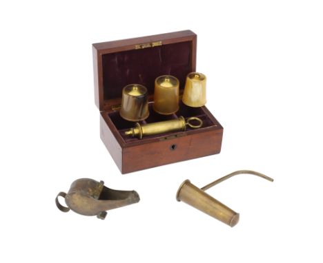 An Unusual Horn Cupping Set, early 19th century, unsigned, fitted velvet lined mahogany case with lock and key, three graduat