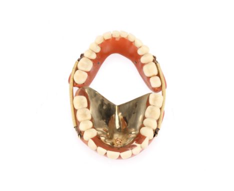 A Complete Set of Sprung Dentures in Gold &amp; Porcelain, English false teeth, c.1850, complete upper and lower plates, uppe