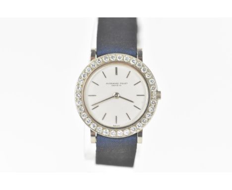 An Audemars Piquet, ultra-thin, manual wind, ladies, 18ct white gold and diamond wristwatch, the dial having baton hour marke