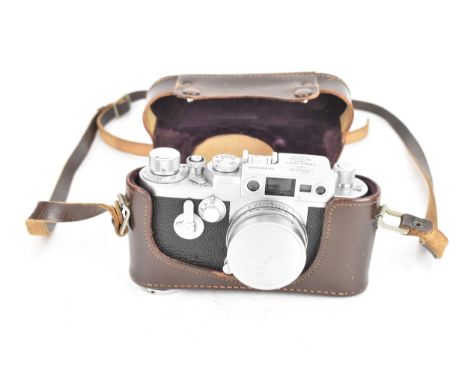 A circa 1957 Leica IIIg ( 111g ) Rangefinder camera, NR.880 080, fitted with a Leitz Elmar f=5cm 1:2.8 lens, NR. 1452796 and 