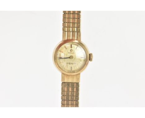 An Omega Ladymatic, manual wind, ladies, 9ct gold wristwatch, the dial having baton markers, integral 9ct gold bracelet with 