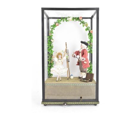 A mid 20th century figural musical automaton of a young artist painting a dancing ballerina under an archway of flowers, stan