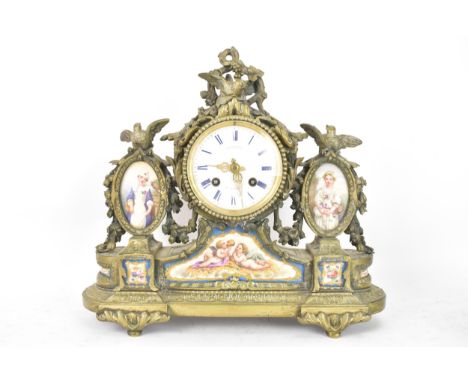 A late 19th century French gilt metal and porcelain 8 day mantle clock, the case cast with birds amongst flowers, inset with 