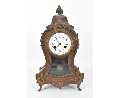 A late 19th century French Potonie Boulle mantle clock, the red tortoiseshell case having a metal flowers shaped finial with 