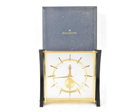A Jaeger LeCoultre mid 20th century skeleton mantle clock, having a gilt and lucite case, visible 8 day movement with a Swiss